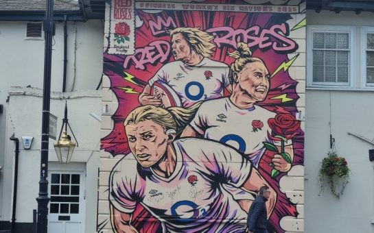 Painted mural of captain Zoe Aldcroft with vice captains Marlie Packer and Meg Jones on the Cabbage Patch pub in Twickenham